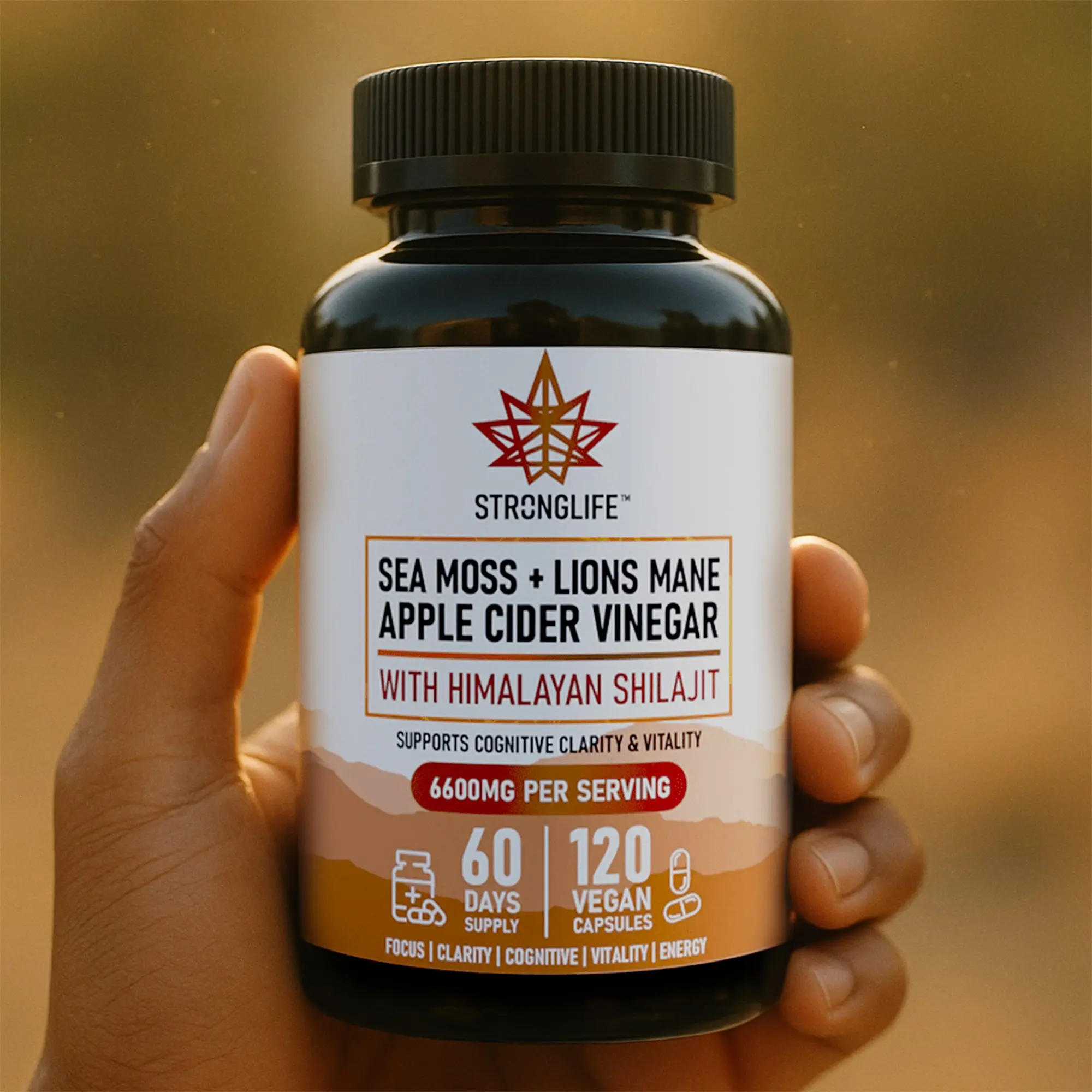shilajit sea moss and lion's mane capsules with apple cider vinegar stronglife supplements natural vegan hand holding